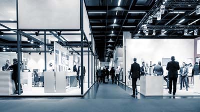 Business,People,Walking,Between,Trade,Show,Booths